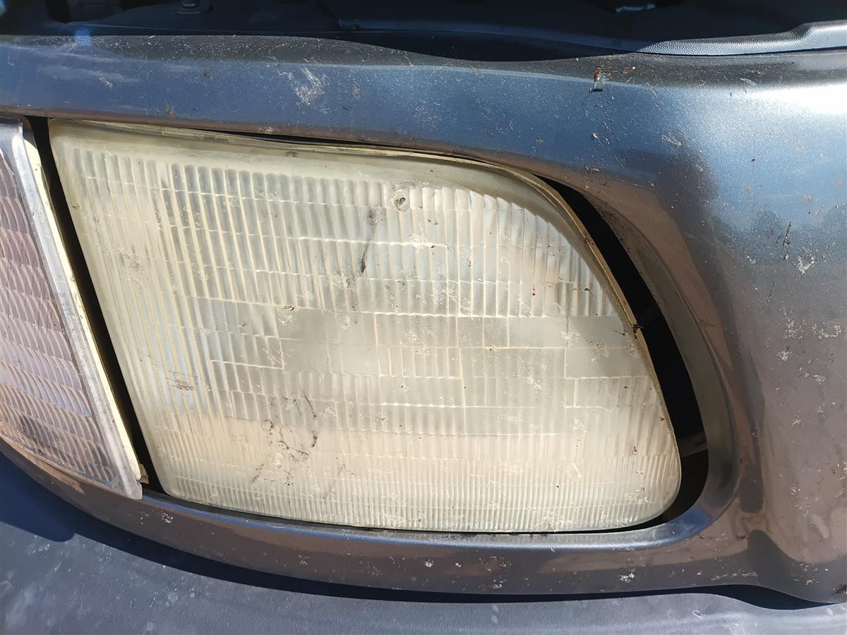 Headlight Assembly from a 2002 Ford F-150, right side, photo 1