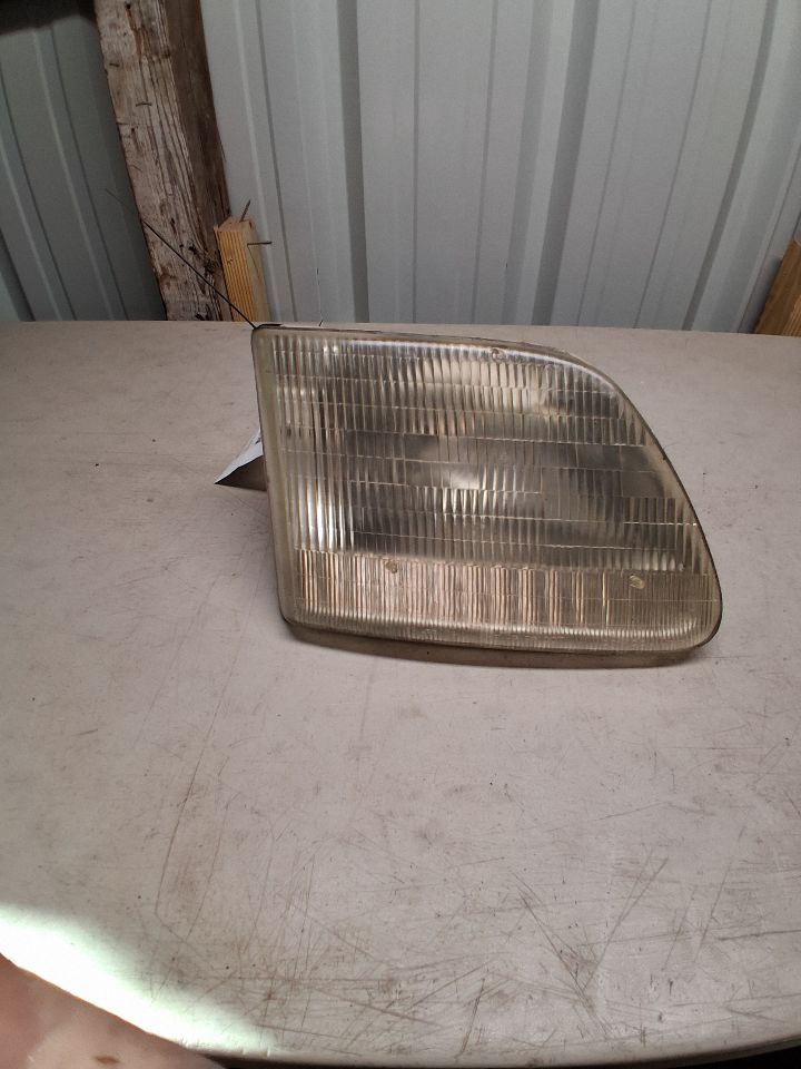 Headlight Assembly from a 2002 Ford F-150, right side, photo 2