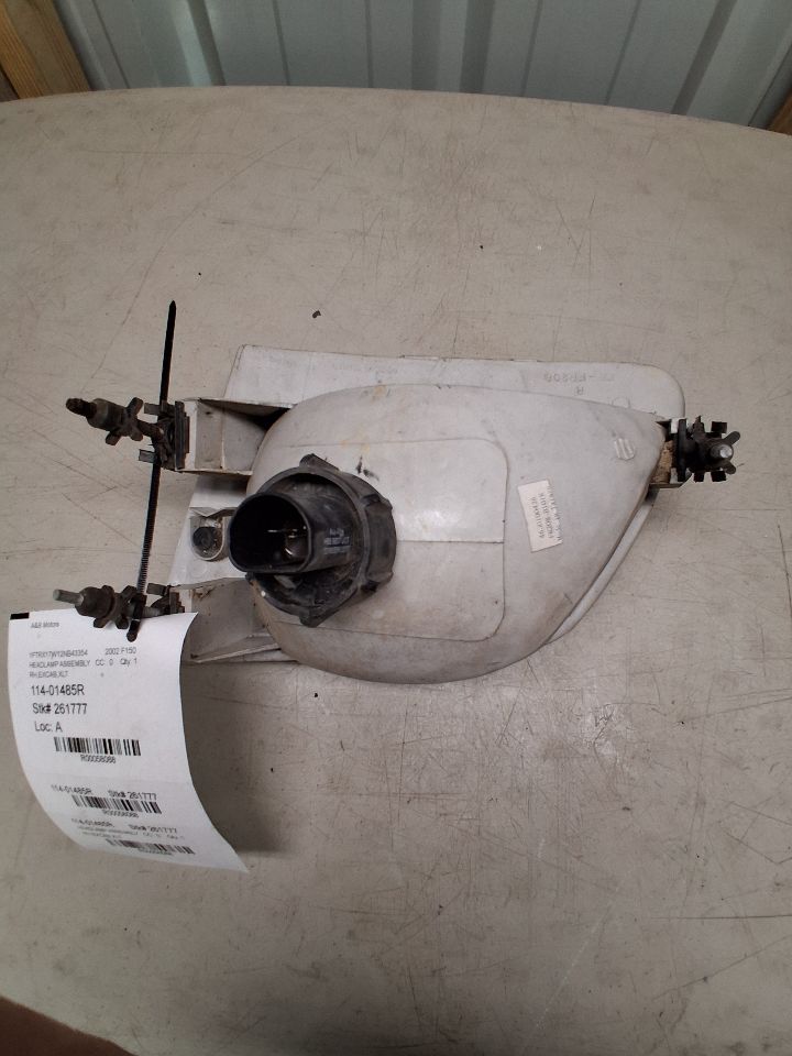 Headlight Assembly from a 2002 Ford F-150, right side, photo 3