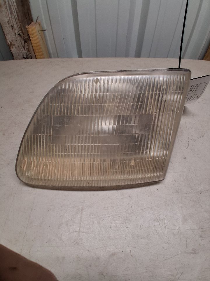 Headlight Assembly from a 2002 Ford F-150, left side, photo 2